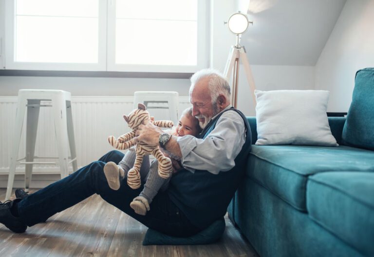 man playing with grandson
